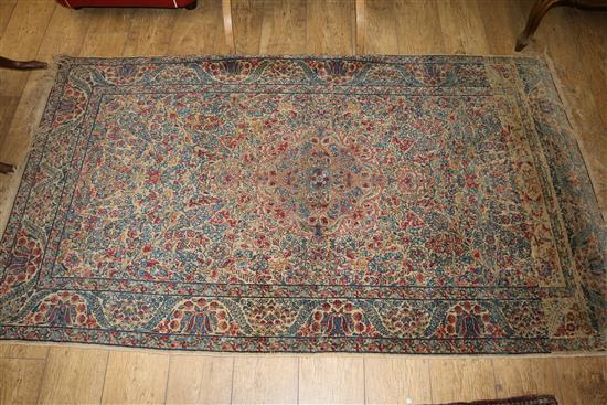 A Caucasian rug with triple medallion on a blue ground and two worn Persian rugs 210 x 120cm, 205 x 135cm and 195 x 145cm